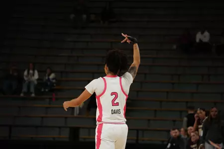 Domonique Davis celebrates after drilled a three-point basket in her final game at RGC
