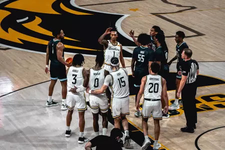 The Golden Eagles huddle during a win over Old Dominion
