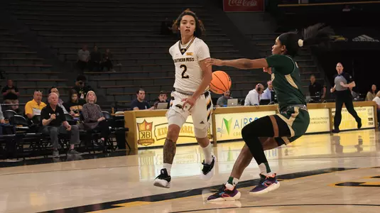 Southern Miss Lady Eagles guard Domonique Davis (2) with a no look behind the back pass in a game between the Southern Miss Golden Eagles and the UAB BLazers in a NCAA WNIT women's Basketball game. March 20 , 2024. (Joe Harper/bgnphoto.com)