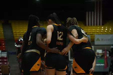 Magnificent Seven huddle at ULM