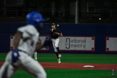 Seth Smith throwing to First