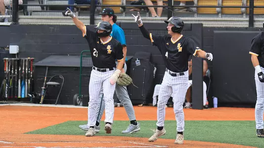 Southern Miss. infielder Ozzie Pratt (4) and Southern Miss. infielder Gabe Broadus (27) congratulate Southern Miss. outfielder Slade Wilks (7) on the hit in a NCAA Baseball game between the Southern Miss Golden Eagles and the Coastal Carolina. May 5, 2024. (Joe Harper/bgnphoto.com)