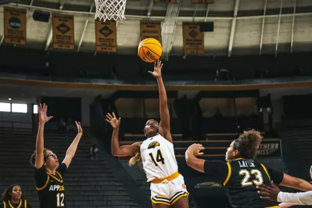 Nyla Jean (14) drives in for layup against App State