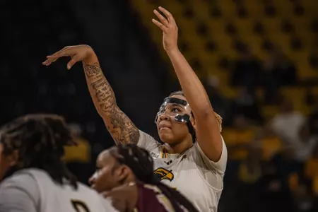 Melyia Grayson (45) scores her 1,500th career point against Texas State