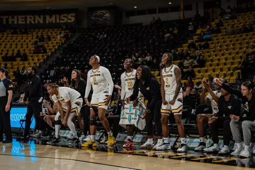 Lady Eagle bench celebrates against Blue Mountain Christian