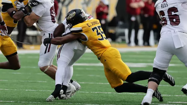 Southern Miss Golden Eagles linebacker Chris Jones (35) makes a stop in a game between Southern Miss Golden Eagles and Troy Trojans and in the NCAA Men’s Basketball game. November 29, 2025 (Joe Harper/bgnphoto.com)