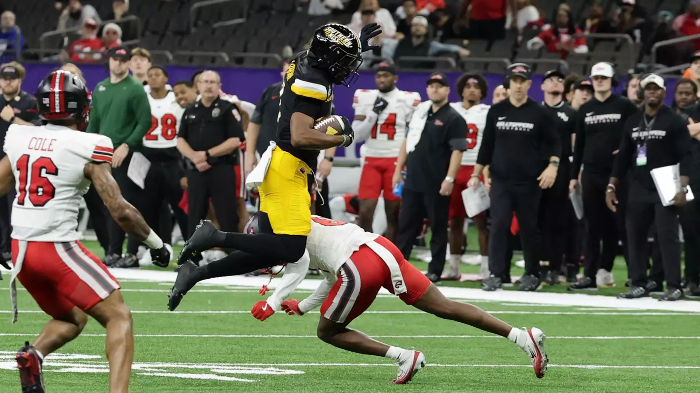 Southern Miss wide receiver Tychaun Chapman (2) leaps over a defender in a game between Southern Miss Golden Eagles and Western Kentucky in the New Orleans Bowl. December 23, 2025 (Joe Harper/bgnphoto.com)