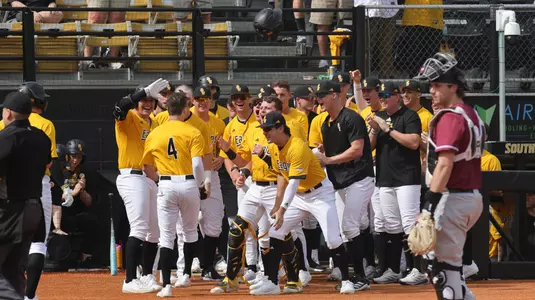 Southern Miss. infielder Ozzie Pratt (4) celebrates with his team mates after this home run in the first game of a doubleheader between the Southern Miss Golden Eagles and the Lafayette Leopards in a NCAA baseball game. February 16, 2025 (Joe Harper/bgnphoto.com)