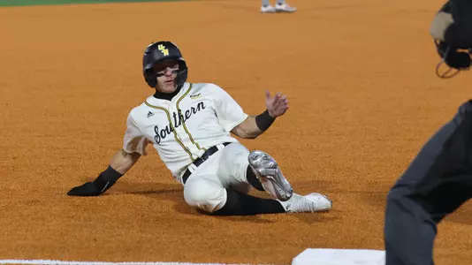 Southern Miss. infielder Nick Monistere (8) slides into third base in a game between the Southern Miss Golden Eagles and the Mississippi State Bulldogs in a NCAA baseball game. February 18, 2025 (Joe Harper/bgnphoto.com)