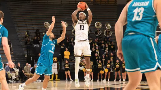 Southern Miss Golden Eagles guard Cobie Montgomery (10) with a three point shot In a game between the Southern Miss Golden Eagles and Coastal Carolina in a NCAA Men’s basketball game February 20, 2025 (Joe Harper/bgnphoto.com
