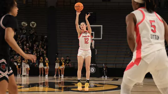 Southern Miss Lady Eagles guard Morgan Sieper (12) shoots a three point shot in a game between the Southern Miss Golden Eagles and Arkansas State in a NCAA basketball game. February 22,,2025 (Joe Harper/bgnphoto.com)