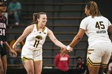 Trinity Rowe (11) and Melyia Grayson (45) celebrate after a basket against Louisiana