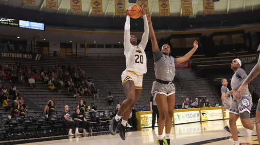 Southern Miss Lady Eagles forward Je'Mya Evans (20) goes up strong past Georgia Southern Lady Eagles forward Indya Green (34) In a game between the Southern Miss Lady Eagles and the Georgia Southern Lady Eagles in a NCAA Women’s basketball game. February 05, 2025 (Joe Harper/bgnphoto.com)