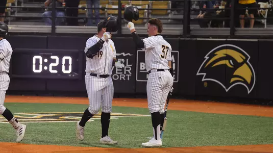 Southern Miss. infielder Matthew Russo (19) and Southern Miss. outfielder Carson Paetow (37) celebrate the home run in a game between the Southern Miss Golden Eagles and South Alabama in the NCAA baseball game. March 28, 2025 (Joe Harper/bgnphoto.com)