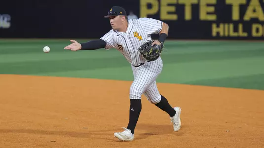 Southern Miss. infielder Matthew Russo (19) flips the ball to Southern Miss. pitcher JB Middleton (18) covering first base to record the out in a game between the Southern Miss Golden Eagles and South Alabama in the NCAA baseball game. March 28, 2025 (Joe Harper/bgnphoto.com)