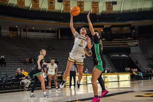 Meloney Thames drives towards the basket against Marshall