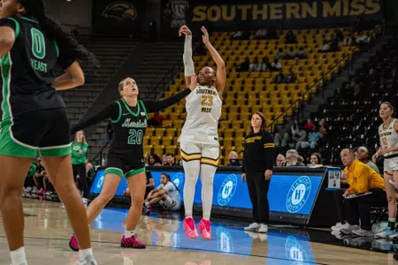 Hayleigh Breland hits a three over a Marshall defender