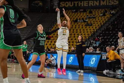 Hayleigh Breland hits a three over a Marshall defender