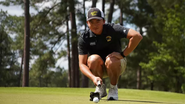 Matthew Javier eyeing up a putt