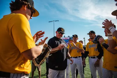 Coach Oz receives game ball after 100th win