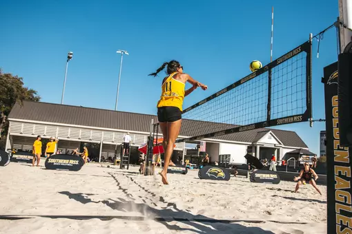 Y-Nhu Do (11) over the net at the Spring Break Slam