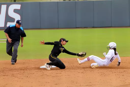 Madison Johnson tagging a runner out