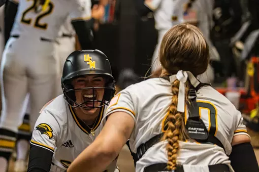 Abbi Troquille celebrating in dugout