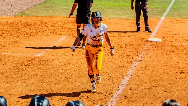 Hannah Christian (31) rounds third towards home after hitting Southern Miss' first home run of the season against Brown