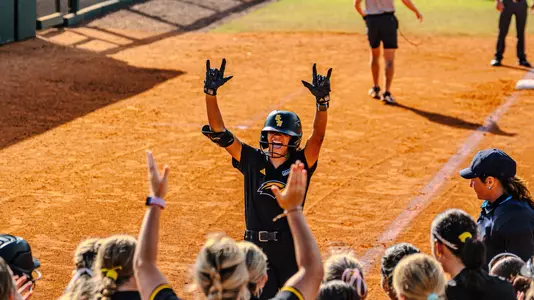 Madison Johnson (4) celebrates a home run against Presbyterian