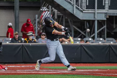 Lawsom Odom makes contact as he registers a hit