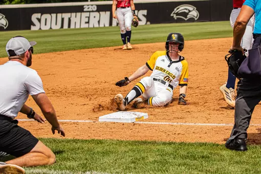 Carrie Green sliding into third base