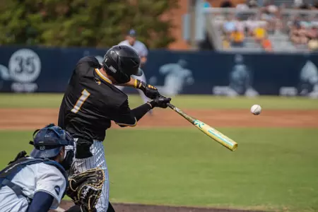 Joey Urban makes contact with one before his Homerun