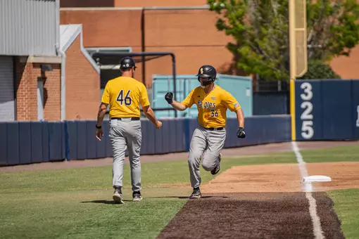 Tucker Stockman celebrates with Travis Creel after his Homerun
