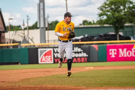 Kyle Morrison returns to the dugout after a successful outing