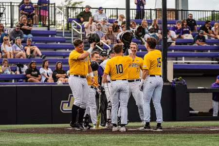 Ben Higdon celebrates at the plate after his homerun