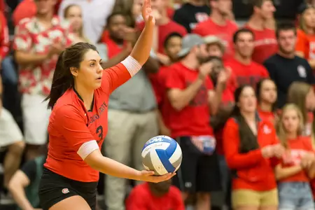 Nicole Miller serving