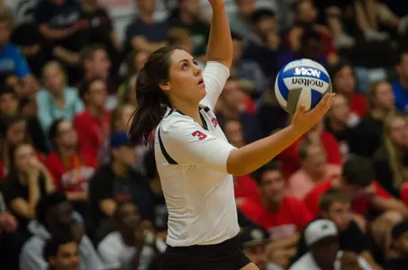 Nicole Miller serving