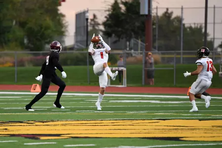 Payton Conrad catches an interception against UMD