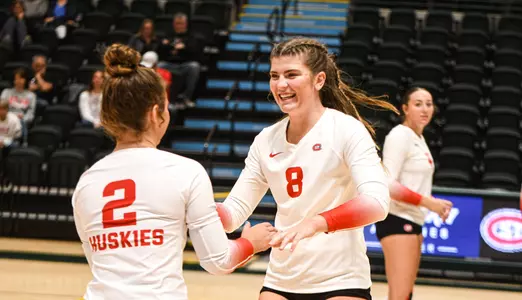 Sophomore defensive specialist Emily Kern (L) and senior outside hitter Kenzie Foley (R) share a laugh during St. Cloud State's win over Florida Tech on September 1, 2023 at the Alaska Airlines Center.