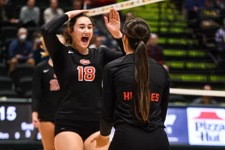 Sophomore setter Emma Berran (18) celebrates a kill by redshirt sophomore middle blocker Sam Zimmerman during St. Cloud State's win over No. 14 Alaska Anchorage on Sep. 1, 2023 at the Alaska Airlines Center.