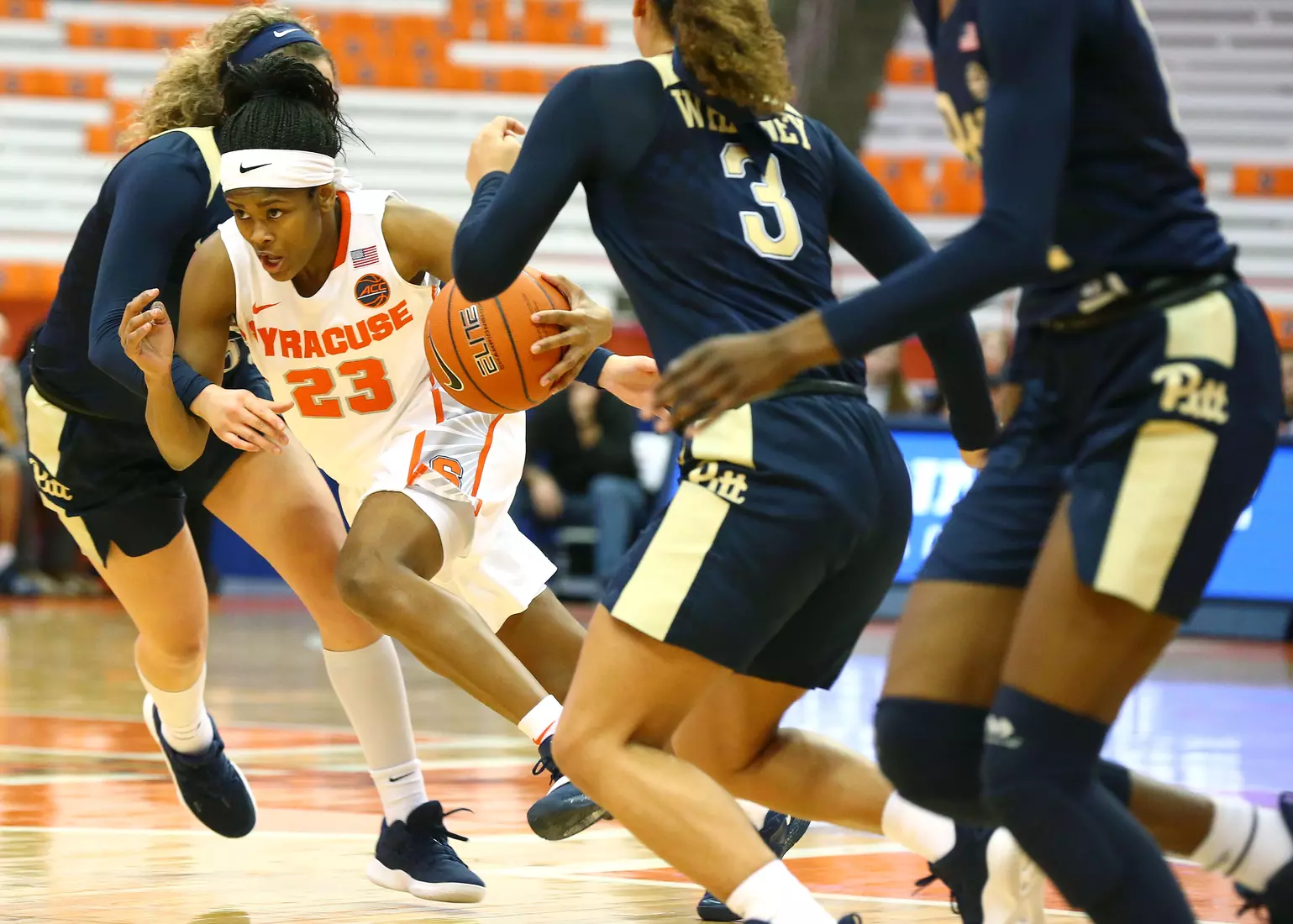 Isis Young is fouled as she drives.