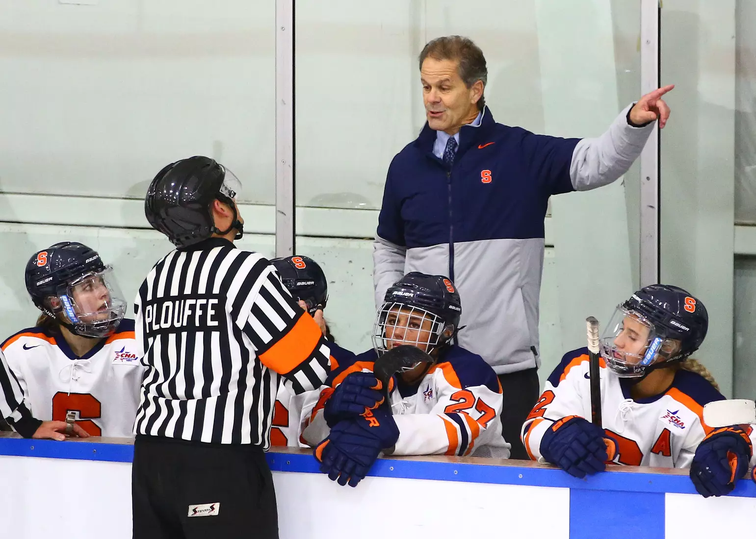 Coach Flanagan has a conversation with an official.