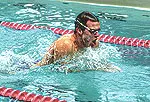 Raymond Sets Pool Record in the Men's 100-Yard Breaststroke Image
