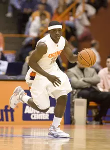 Three in a Holiday Bow: Orange Out-Muscles Cornell, 80-64 Image