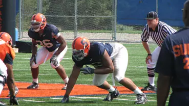 Orange Go Live In Scrimmage Action Image