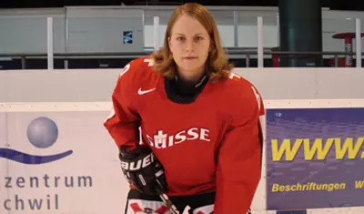 Stefanie Marty posing in her Swiss uniform.