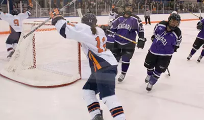 Julie Rising celebrates a goal against Niagara.