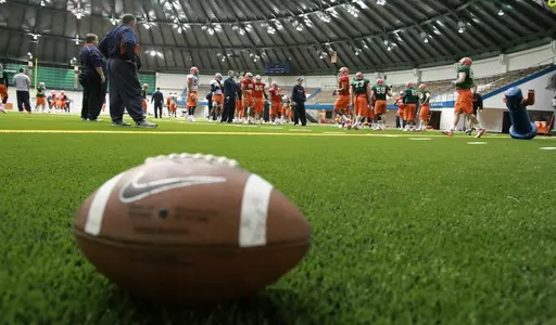 Football practice in the Manley practice facility