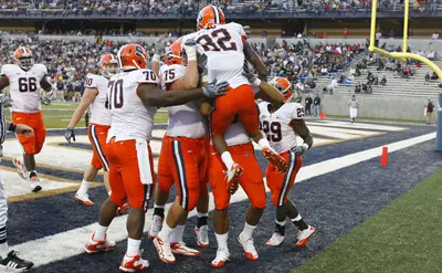Van Chew celebrates after scoring a touchdown at Akron.