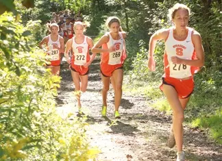 Four SU harriers running up hill.